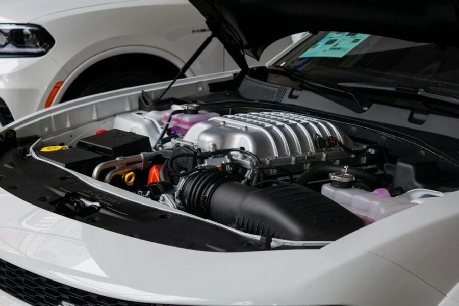 Open engine bay of a white car