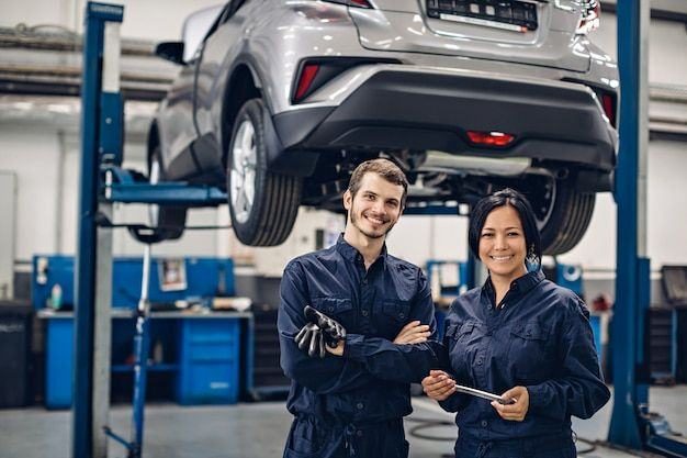 Two smiling technicians in the workshop