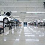 Bright workshop with cars on lifts
