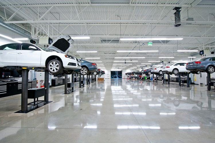 Bright workshop with cars on lifts