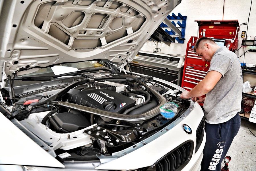 Open engine bay of a performance car in the workshop